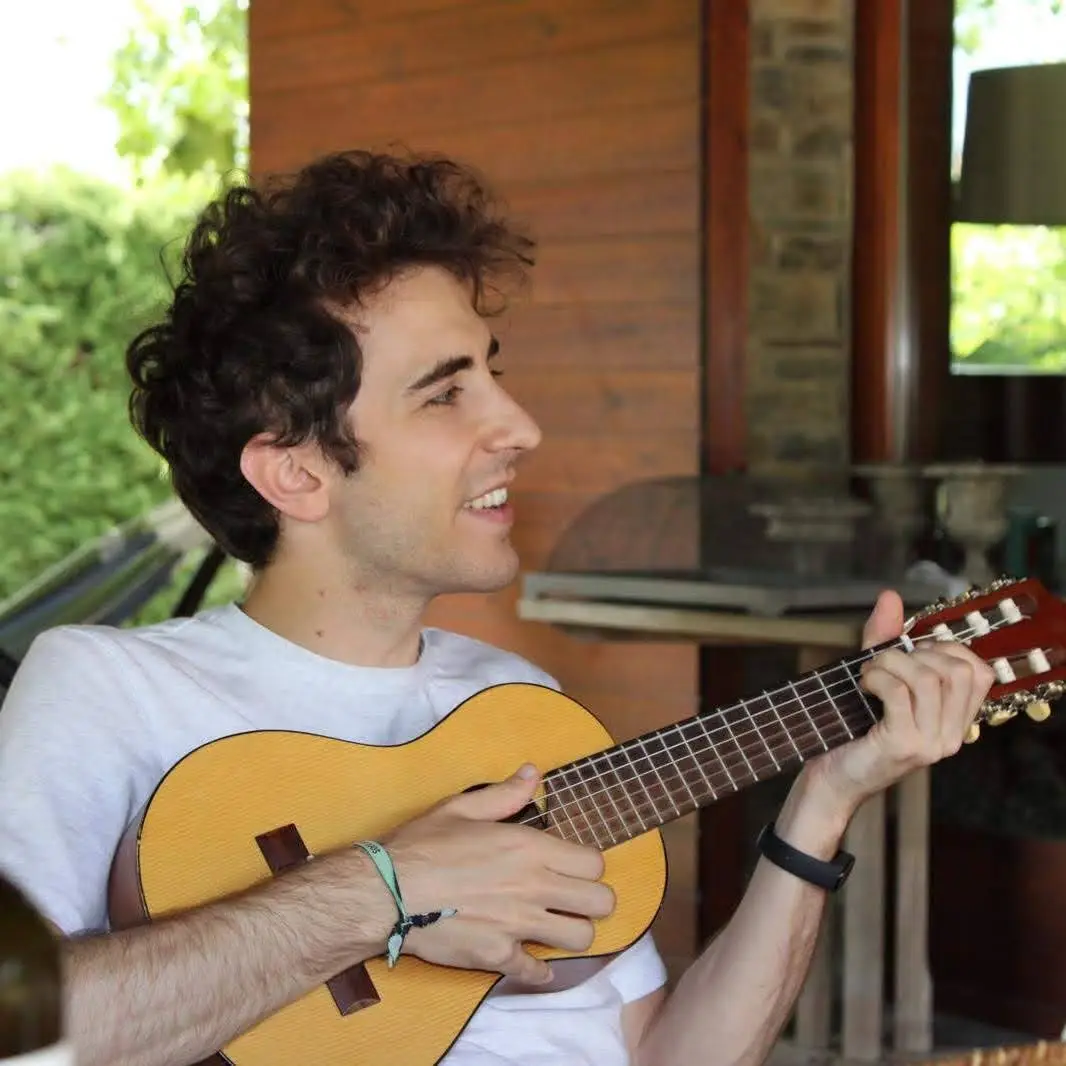 Santi playing guitar